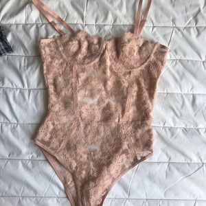 Pink teddy body suit never worn